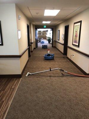 Cleaning a retirement home, using our fans to make sure it's dry before we leave.