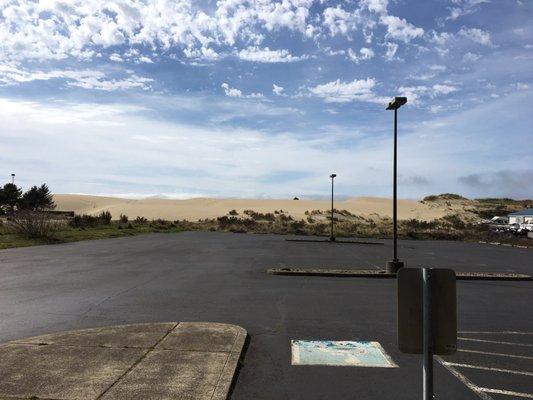 The dunes behind our store and our large parking lot