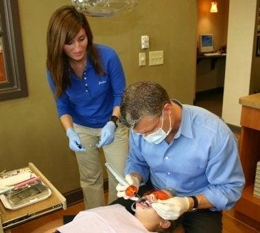 Dr. Awbrey and staff placing braces