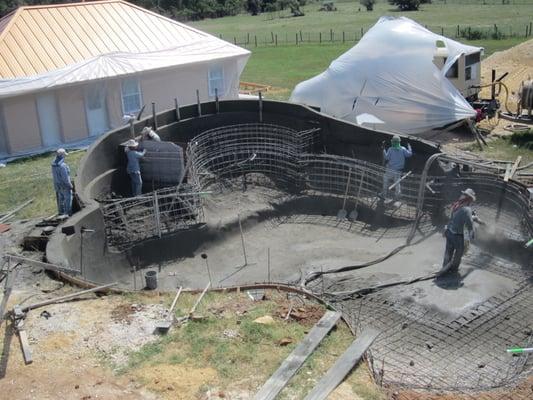 Gunite being used for pool construction