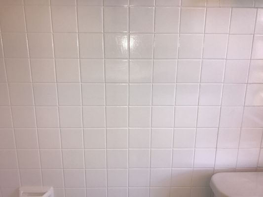 Old crack in the tile is now barely visible after they applied a fresh coat of paint