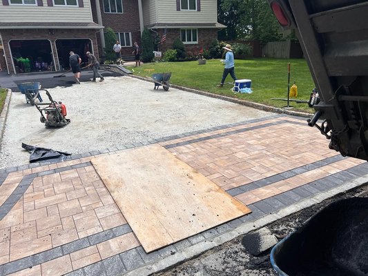 blacktop driveway with belgium block edge and Cambridge armortec paver apron and stoops with veneer stone facing