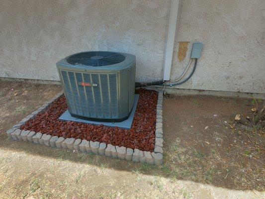 Trane condenser new install!
 Nice touch with the customers decision to do some landscape rocks and trim around!