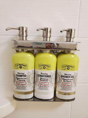 Luxury shampoo, conditioner and shower gel in the shower