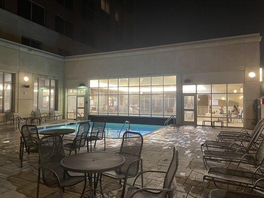 View from outside looking in at the pool/hot tub.