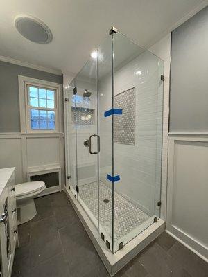 Shower glass enclosure with a swing door