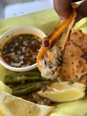 Birria tacos with a side of consume