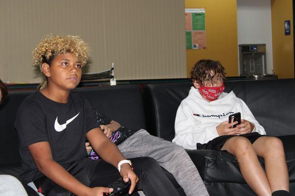 Students playing video games in the gameroom.