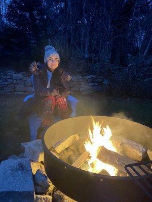 Sitting by the fire on a chilly night at Acadia Cottage.