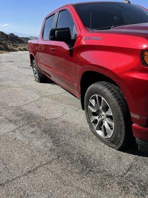 Both tires blown on a sketchy mountain road