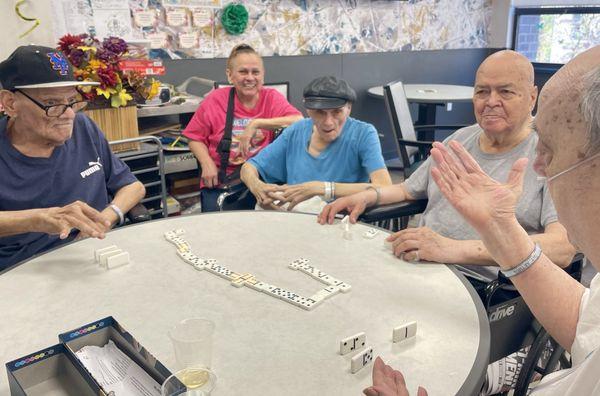 Third floor residents enjoying a friendly game of dominos...