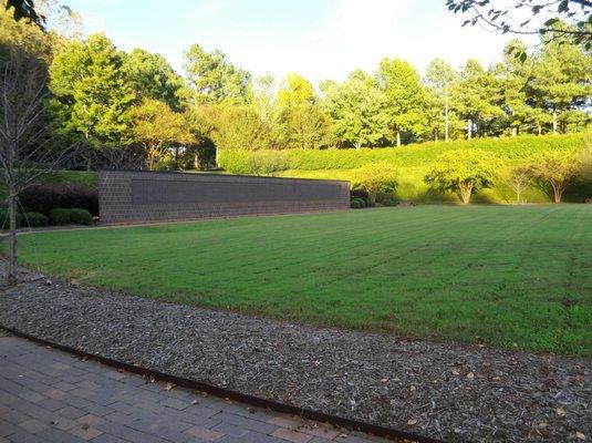 with the approach of darkness the wall gives back the gentle warmth of the daytime sun...