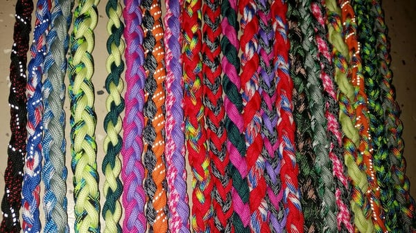 A wall of paracord leashes! Light weight, strong, durable, mold and mildew resistant, washable and safe!