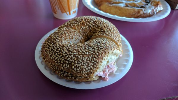 Sesame bagel with strawberry cream cheese