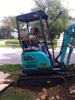 Letting my son have a ride on the digger