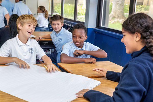 6th grade students working collaboratively on a project in Language Arts