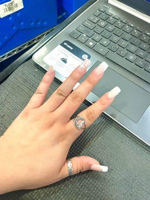 customized standard white french tip with ring finger design done by Tina