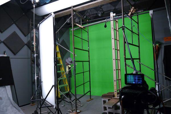 Green screen stage with a custom set-up to match studio footage with outdoor footage.