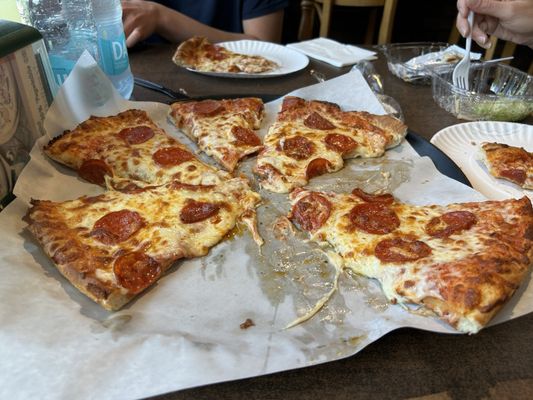 Pizza with plenty of cheese and toppings. Fed three with no fussing