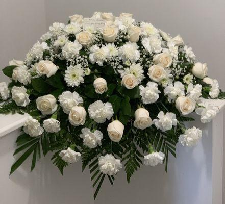 Roses, Carnations, Gerber Daisies, Baby's Breath, and Mixed Greens of Casket Cover