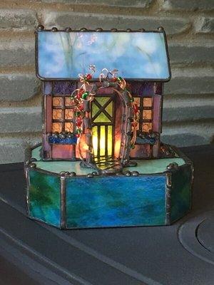 Stained glass cottage with light