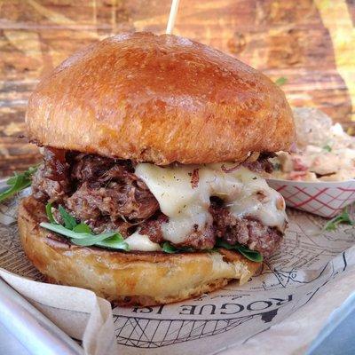 Short Rib Burger: grass fed beef, stout braised short rib, pepper jack, caramelized onion jam, honey mustard aioli, onion string