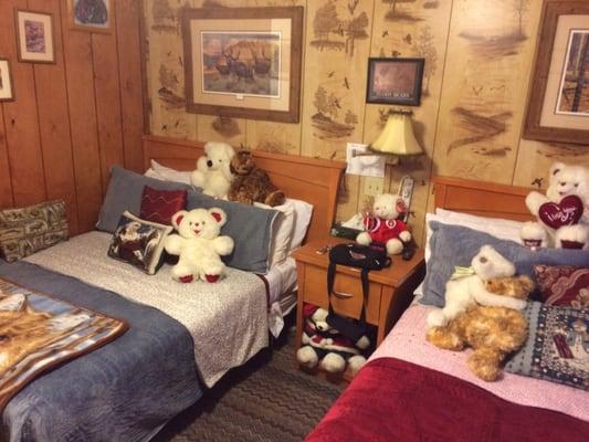 2 beds with a lot of bears