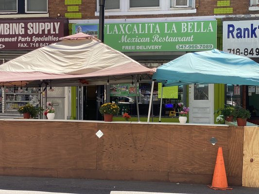 View from across the street showing the outdoor dining area