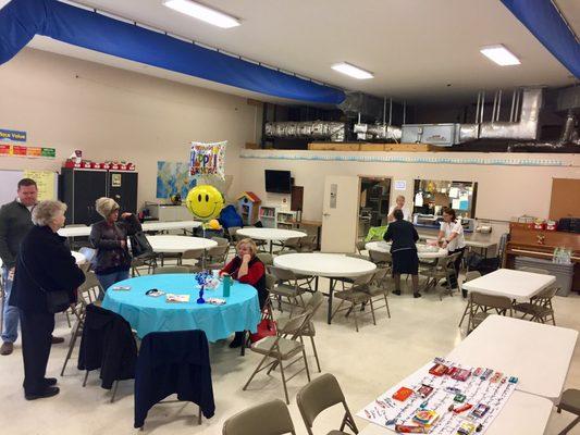 Small event room with attached kitchen.