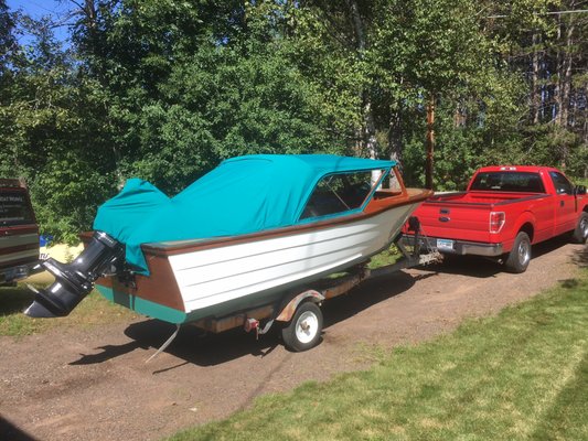 New Canvas top on freshly restored 1962 Dunphy Voyager wooden boat.