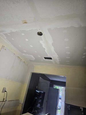 Drywall ceiling repair completed without paint