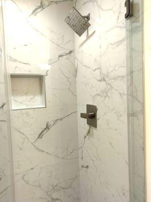 Calacatta marble tiles in all bathrooms