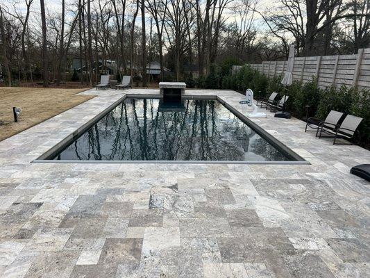 Concrete pool, silver travertine decking and copping, grotto