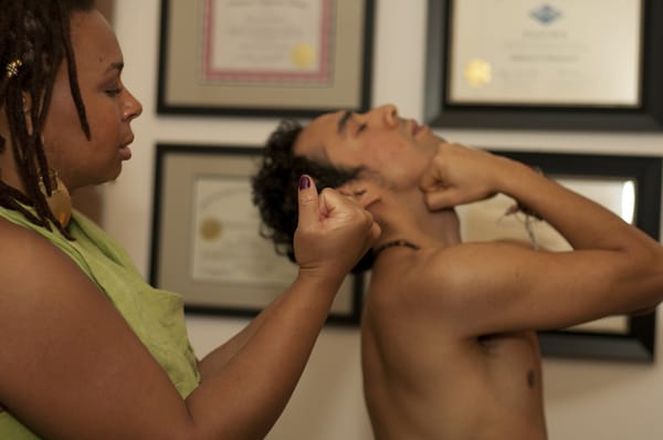 This stretch is beneficial for neck tension, please do not jerk your neck back. Move your neck back slowly with your fist.