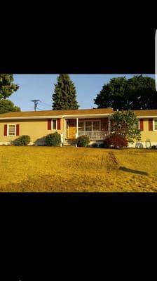 (Front view, completed) vinyl siding and a stone accent on the front porch