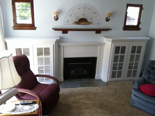 Here is a fireplace surround with glass doors that I made to replace the outdated tile hearth.