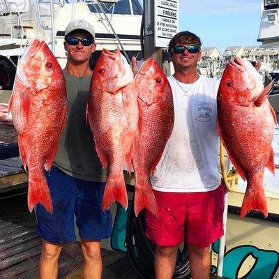 Clinton Collier and Chris Garcia with 4 giant red snappers caught aboard the Escape!  Captain Skipper Thierry