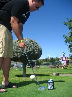 Lining up for a difficult putt on hole 12.