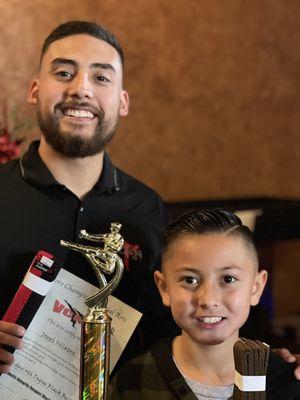 Sensei awarding Aiden at end of year belt ceremony!