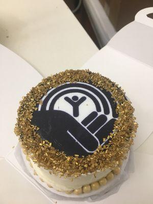 Custom logo mini cake with gold sprinkles and Butterrum icing