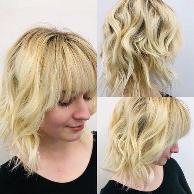 Blonde highlight with a beach shag haircut and curl