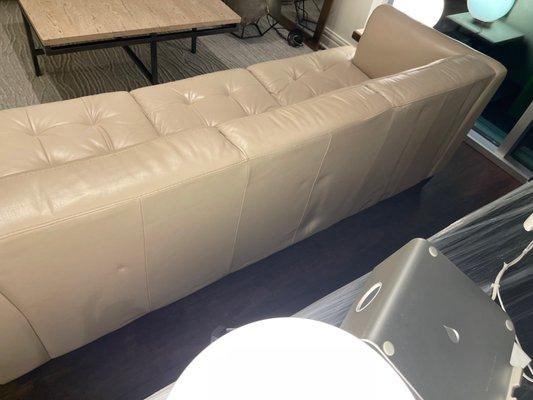 Dented leather couch due to improper storage