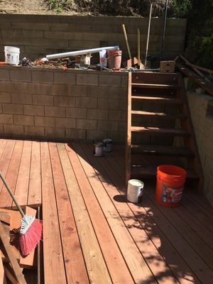 Red wood deck with small stairs