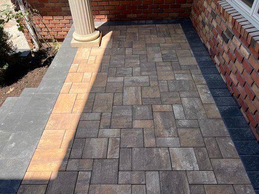 blacktop driveway with belgium block edge and Cambridge armortec paver apron and stoops with veneer stone facing