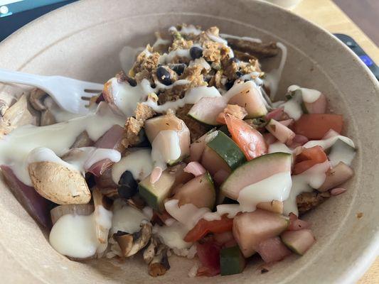 Build A Bowl Medium-brown rice, black bean burger, mushrooms, red onion, cucumber salad and queso