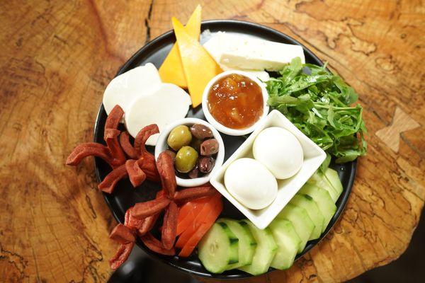 Go international with a classic Turkish breakfast with salad, cucumbers, sausages, tomatoes, mozzarella, gorgonzola, cheddar & olives