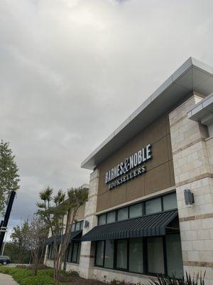 Parking Lot side Signage under dark clouds on 04/26/24