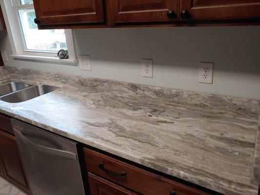 Fantasy brown granite kitchen countertops and backsplash.