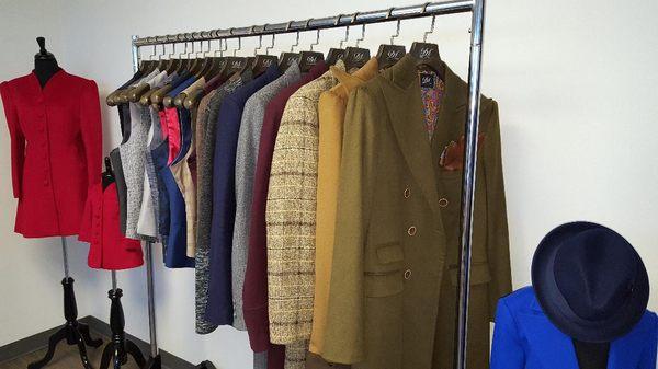 Suit and winter coat samples located in our showroom. Over 10,000 fabrics available, completely custom made to fit the client's body.