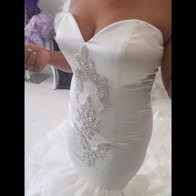 Custom bridal gown with crystal embellishment details.